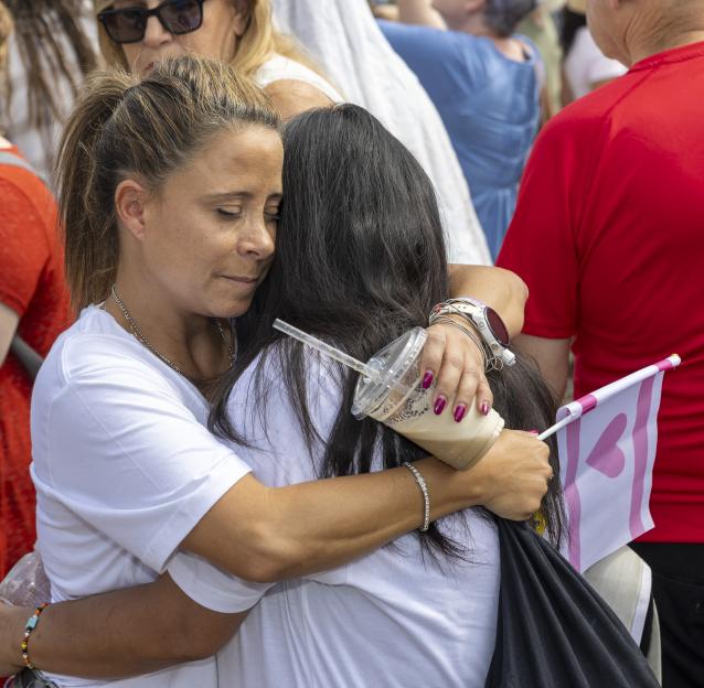 Two women embrace at Hostage Square in Tel Aviv.