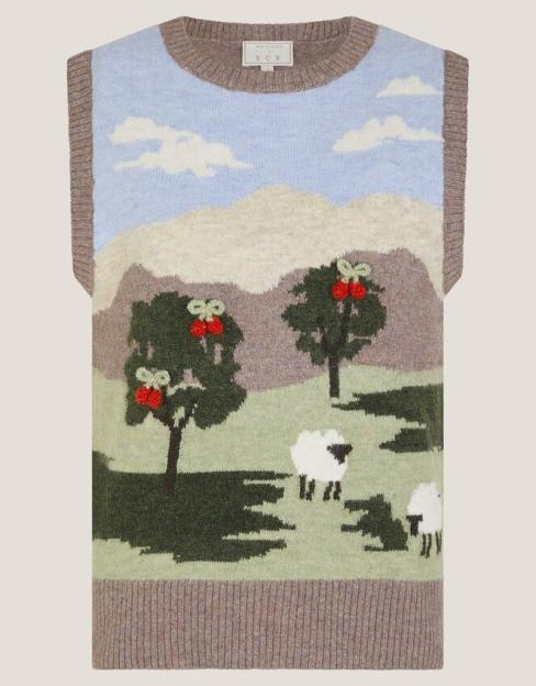 Knit sleeveless top with a scenic pattern of mountains, trees with red berries, and white sheep.