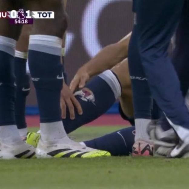 Soccer player injured on the field.
