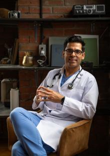 Doctor sitting in a chair.