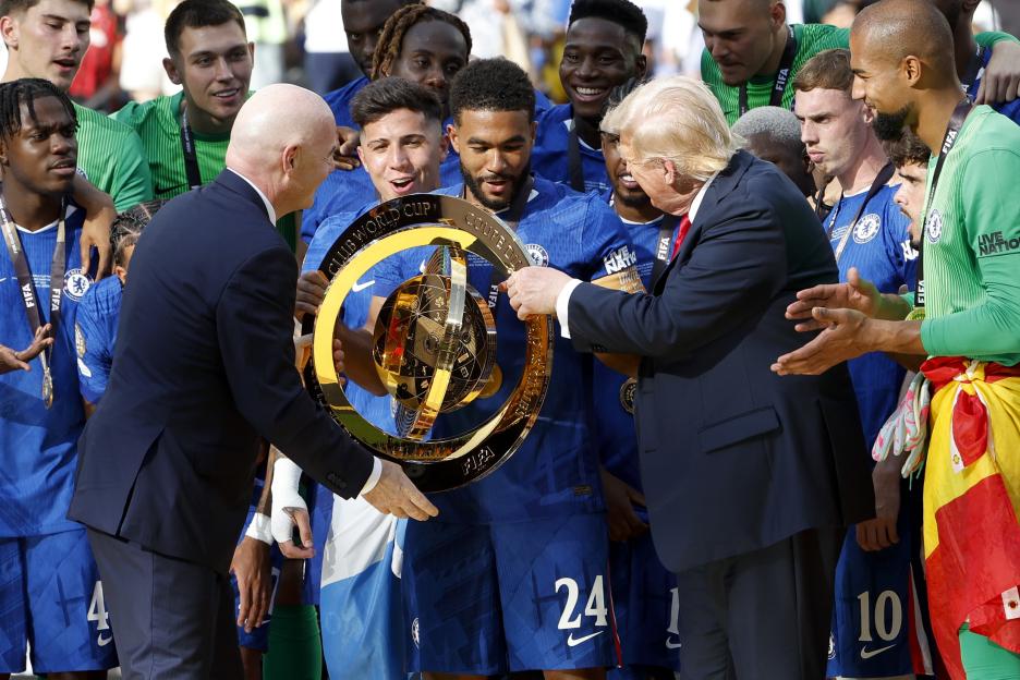 FIFA President Gianni Infantino and US President Donald Trump presenting the Club World Cup trophy to a Chelsea player.