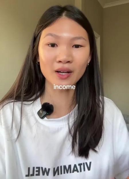 A young woman discusses not spending money on designer goods.