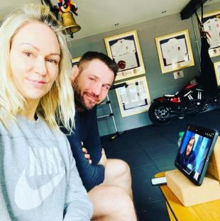 Ben Cohen and Kristina Rihanoff at home watching a tablet.