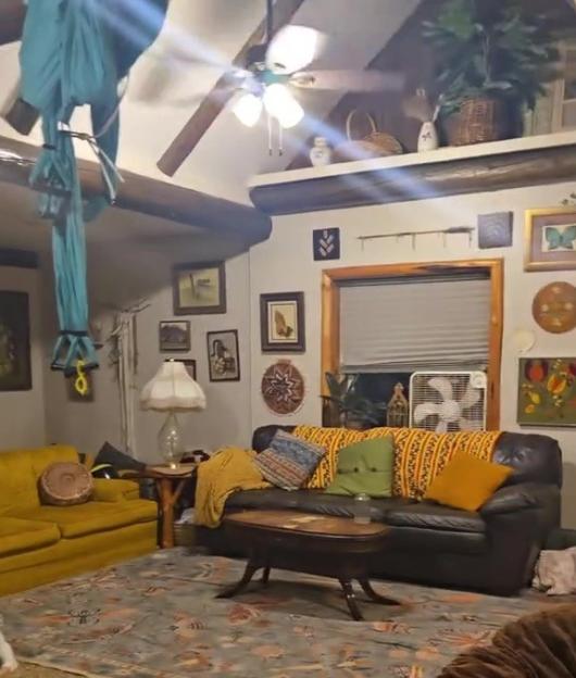 Living room with a hidden toy room behind the couch.
