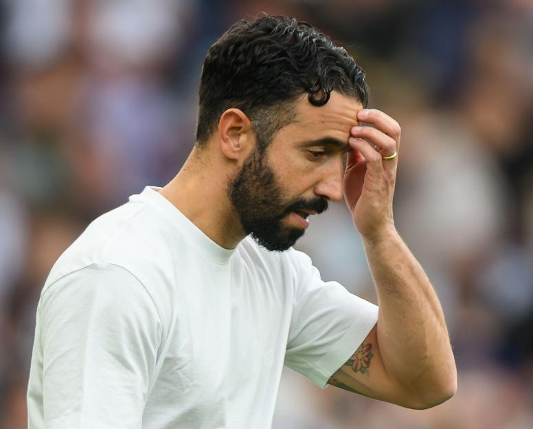 Manchester United manager Ruben Amorim looking downcast after a match.