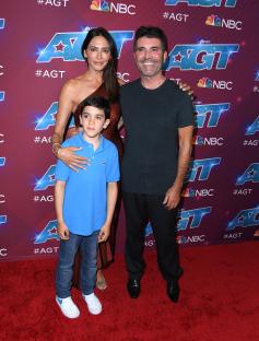 Lauren Silverman, Eric Cowell, and Simon Cowell at the America's Got Talent red carpet.