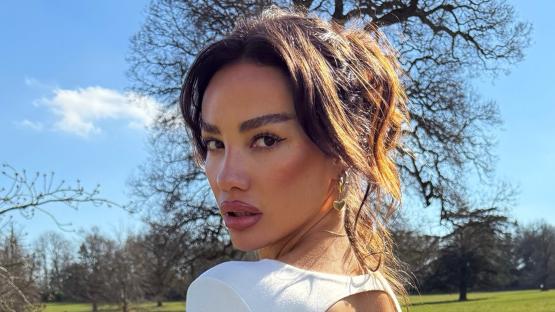 Dele Alli’s model ex-girlfriend Ruby Mae shows off incredible curves as she bends down to pick flowers in backless dress