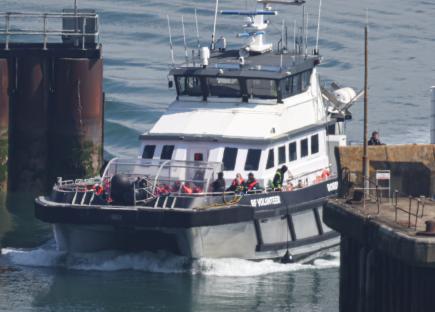 Boat bringing in migrants at the Port of Dover.