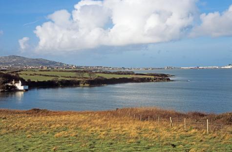 View of Holyhead town, port, and Holyhead Mountain from Penrhos Coastal Park.
