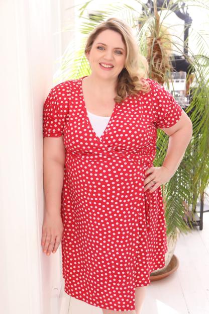 Woman in red polka dot dress.