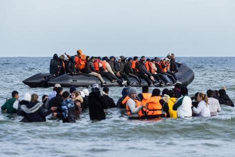 Migrants in a small boat attempting to cross the English Channel.