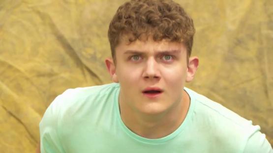 Shocked young man in a light green shirt.
