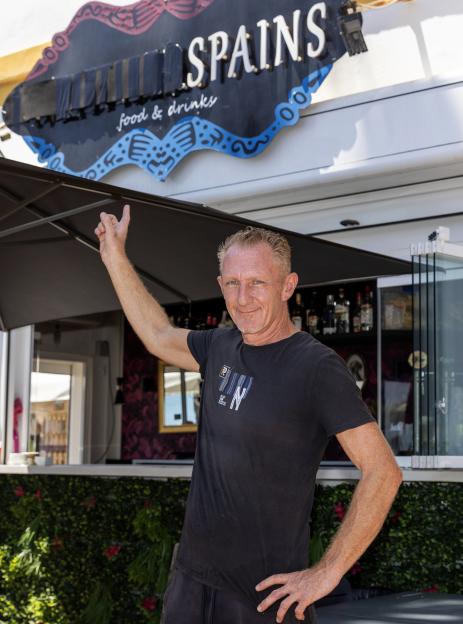 Andy Inman, co-owner of the WeatherSpains Bar, gives a thumbs-up.