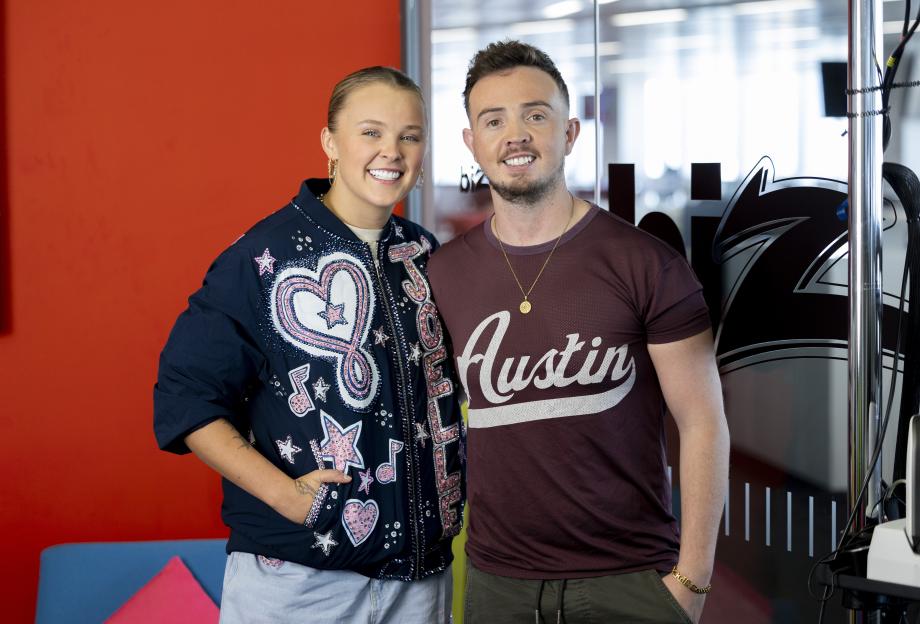 JoJo Siwa and Jack Hardwick posing for a photo.