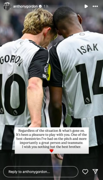 Two soccer players embracing.
