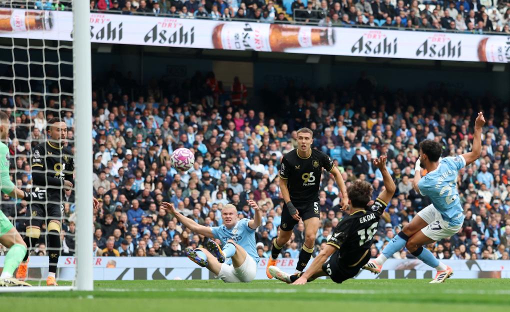 Matheus Nunes of Manchester City scoring a goal during a soccer match.