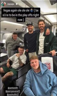 Five men on a plane, celebrating making the playoffs.