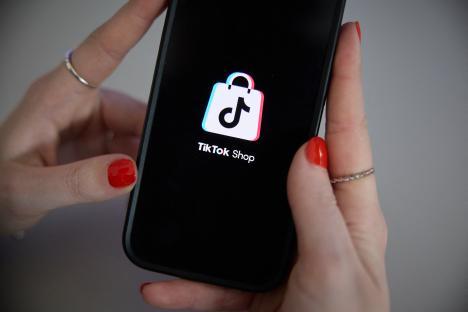 TikTok Shop logo on a phone screen.