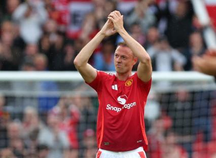 Jonny Evans of Manchester United applauding the crowd.