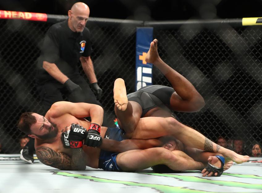 Paul Craig applying a hold on Jamahal Hill during a UFC match.