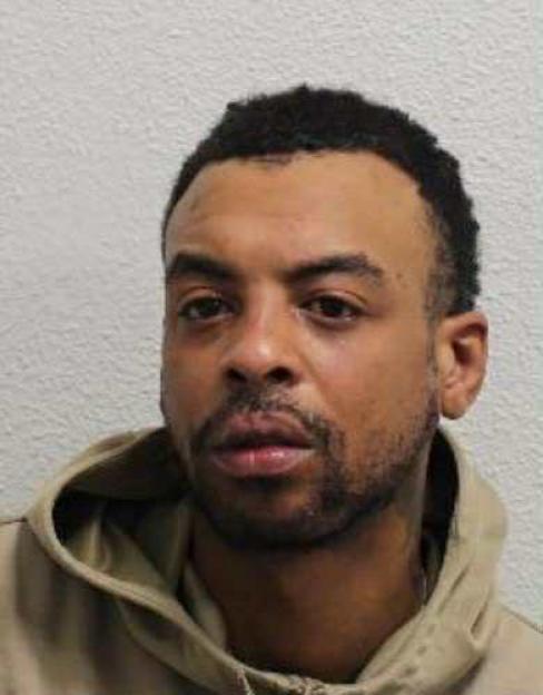 Moment yob knocks pub-goer out with single punch outside Spoons… before calmly sipping his drink as he wanders away