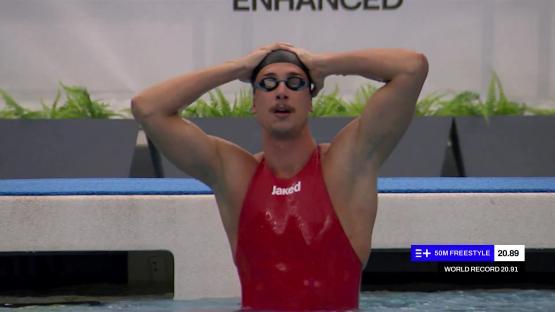 Swimmer in red swimsuit after a 50m freestyle race.