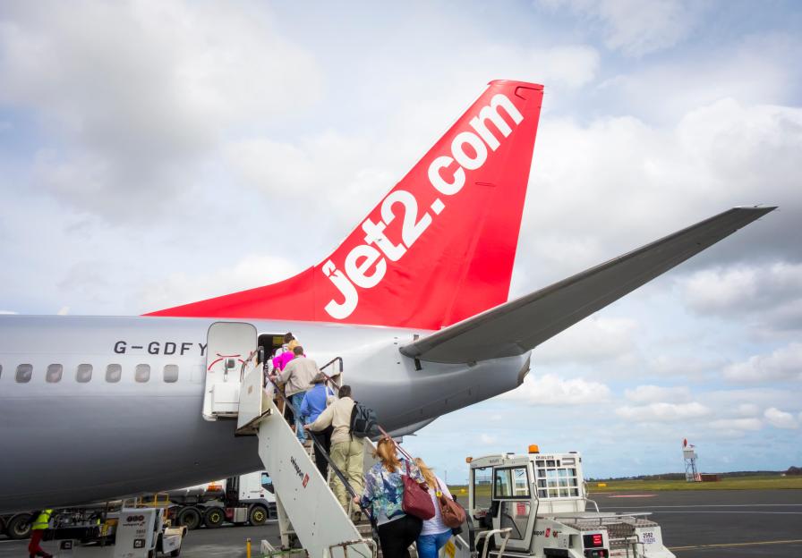 Passengers boarding a Jet2.com flight at Newcastle Airport.