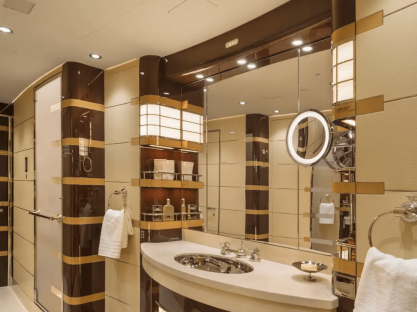 Luxury airplane bathroom with sink, vanity, and shower.