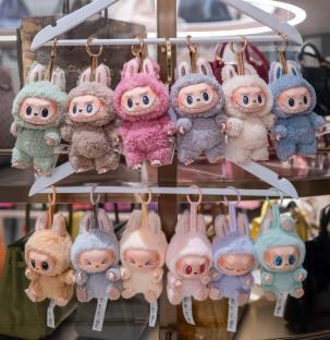 Row of Labubu bunny keychains.