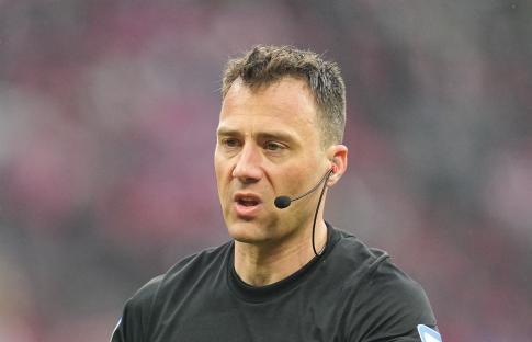 Felix Zwayer, referee, wearing a microphone during a Bundesliga match.