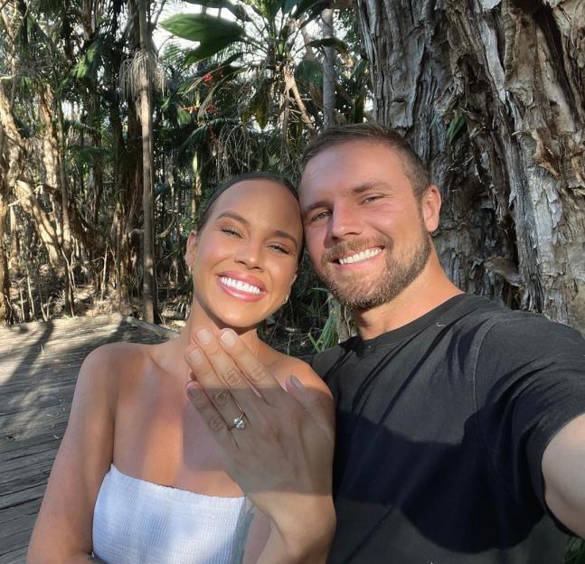 Bonnie Anderson and her fiancé showing off her engagement ring.