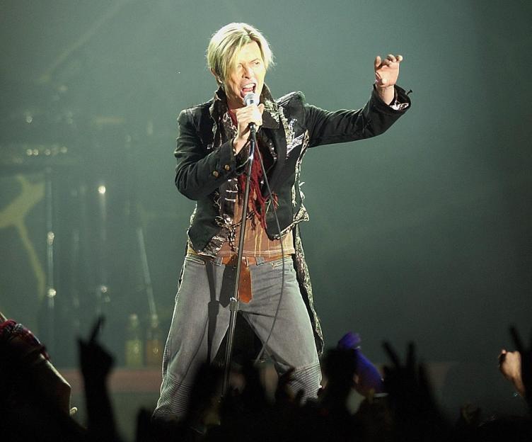David Bowie performing on stage.