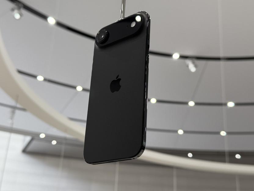 Black iPhone Air 1 hanging from the ceiling.