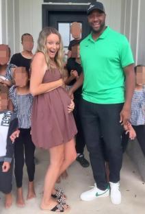Pregnant woman with her large family.