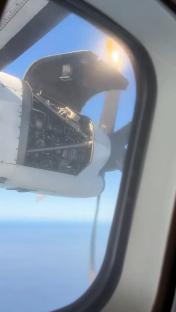 Horrifying moment plane engine panel comes off mid-air and begins to flap dangerously just inches from the propeller