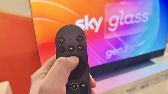 Hand holding Sky Glass Gen 2 remote.