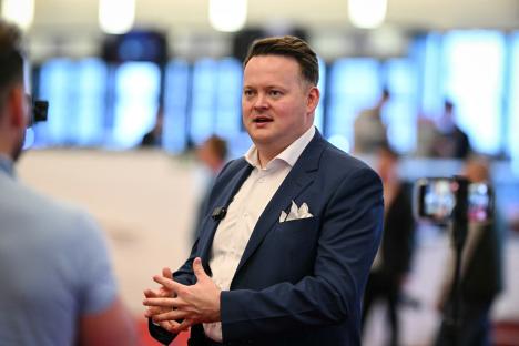 Shaun Murphy speaking at a media event.