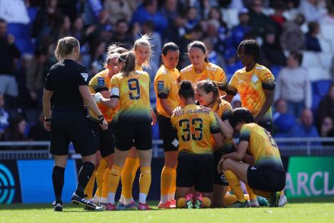 London City Lionesses soccer team celebrating a goal.