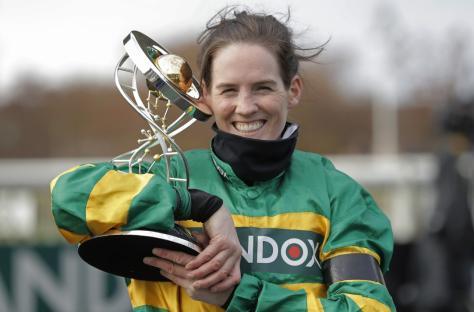Rachael Blackmore celebrates with the trophy after victory on Minella Times in the Grand National on day three of the Aintree Grand National racing festival 2021 at Aintree Racecourse on April 10th 2021 in Liverpool (Photo by Tom Jenkins/Getty Images)