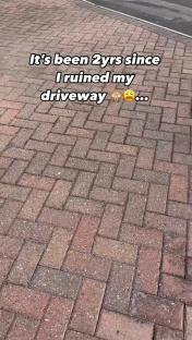 A brick driveway two years after being painted.