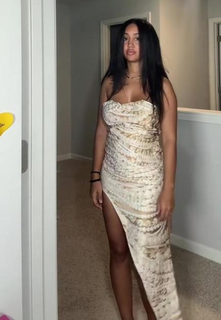 Woman in a patterned dress.