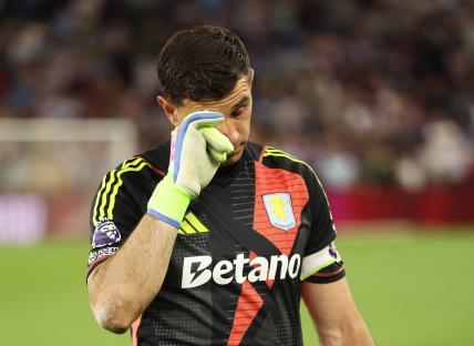 Emiliano Martinez of Aston Villa wiping away tears after a game.