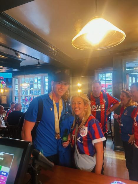 Dean Henderson at a pub with fans.