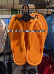 Orange jelly sandals on display.