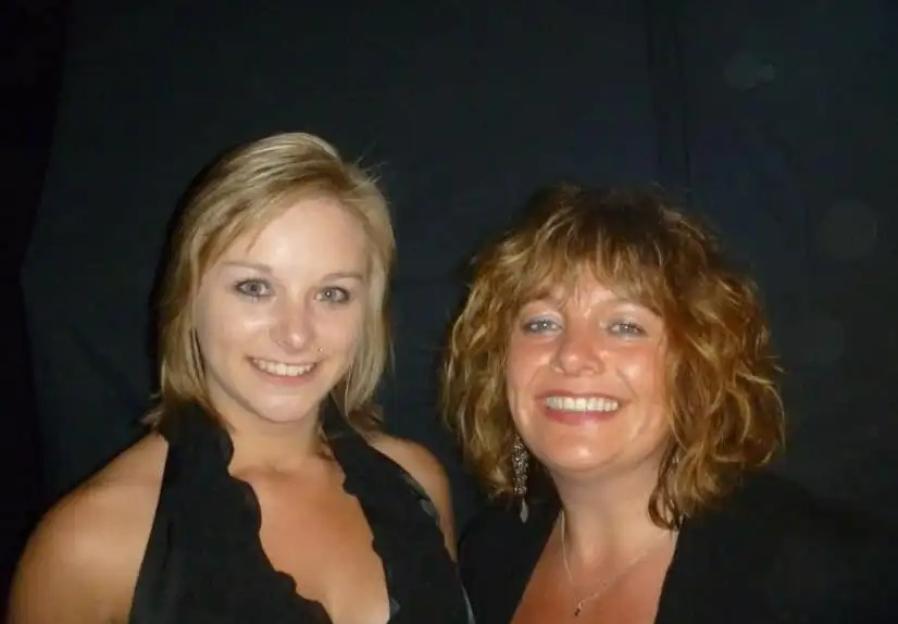 Photo of two women smiling for a picture.