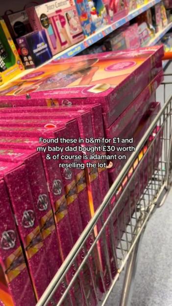 A shopping cart filled with multiple pink boxes of "Icon" merchandise.