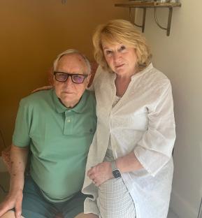 A couple poses for a photo.