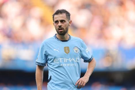 Bernardo Silva of Manchester City in a light blue jersey.