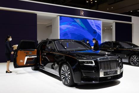 Black Rolls-Royce Ghost Extended sedan on display at a car show.