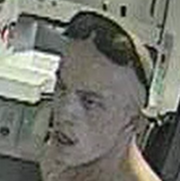 Surveillance image of a man sought for questioning.